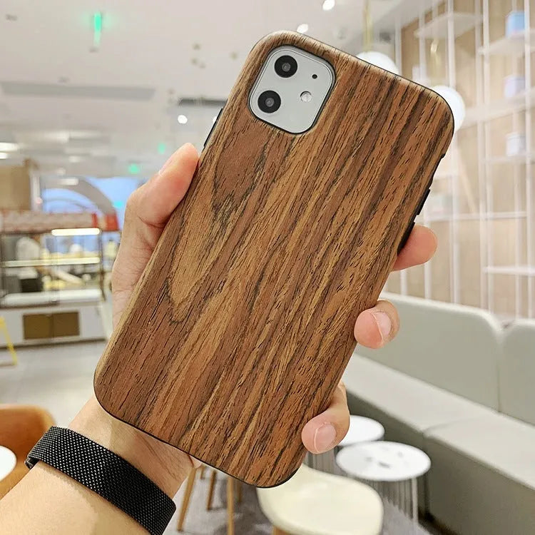 A simple wooden back cover case for an iPhone, shown in a rosewood finish.
