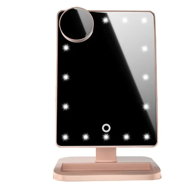 Touch screen makeup mirror with 20 LED lights and Bluetooth speaker on a dressing table with pink finish