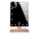 Touch screen makeup mirror with 20 LED lights and Bluetooth speaker on a dressing table with pink finish