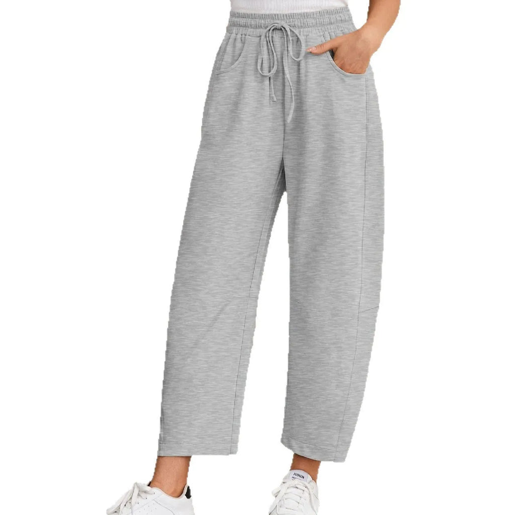 Loose cropped cotton sweatpants with drawstring waist and side pockets in street fashion style