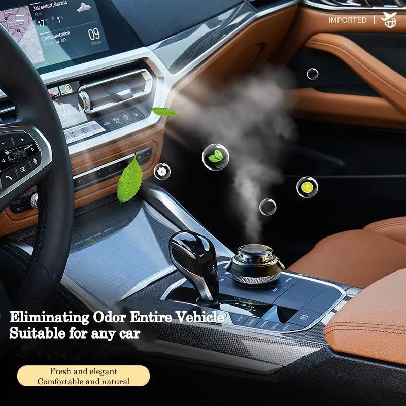 Black solar-powered car air freshener with rotating double rings on car dashboard