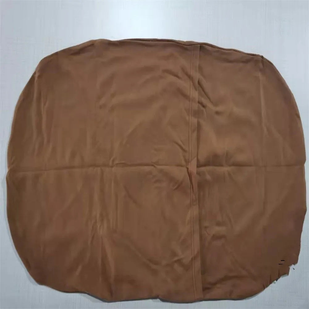 Beige portable baby nest crib cot for newborns on a neutral background.