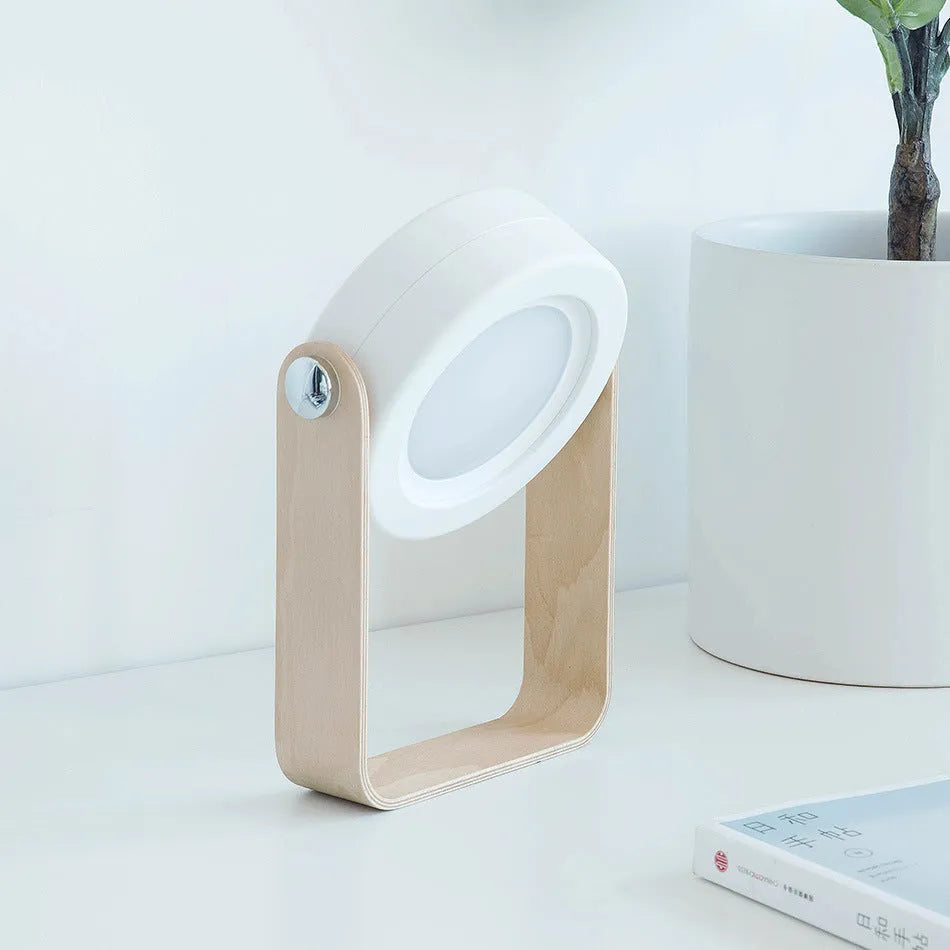 Foldable touch dimmable LED night light in table lamp mode with wood and PC construction, white finish