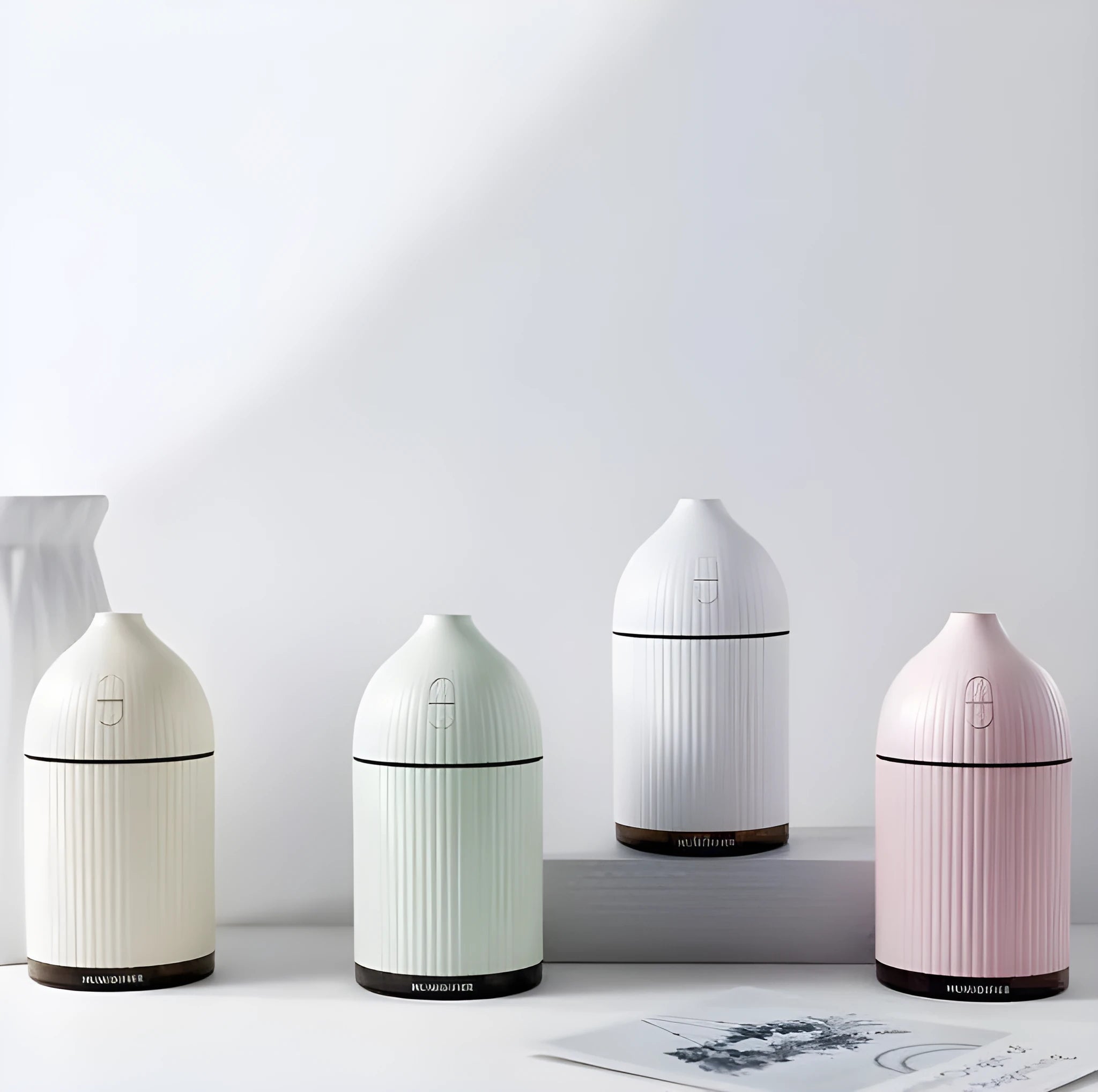 White ultrasonic aromatherapy diffuser and humidifier with LED light, 300ml capacity, and USB cable