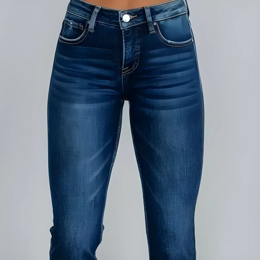Women's solid colour cotton denim jeans with a hand-worn finish in dark blue.