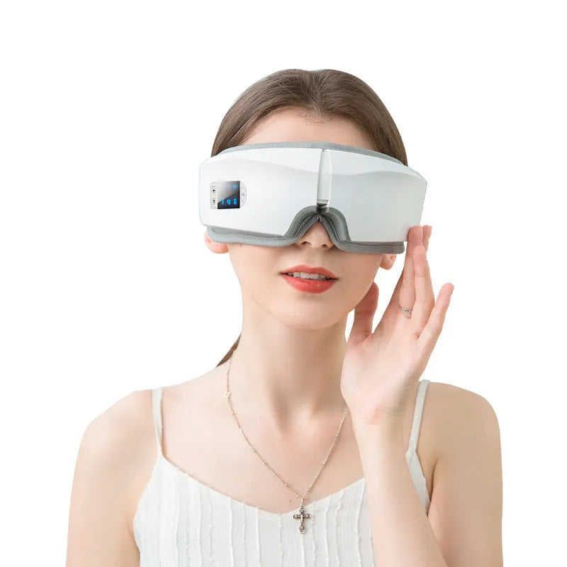 White foldable eye massager with PU mask, LCD screen, USB charging and Bluetooth music