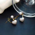 Heart-shaped alloy stud earrings with electroplated finish and artificial gem inlays in Korean style