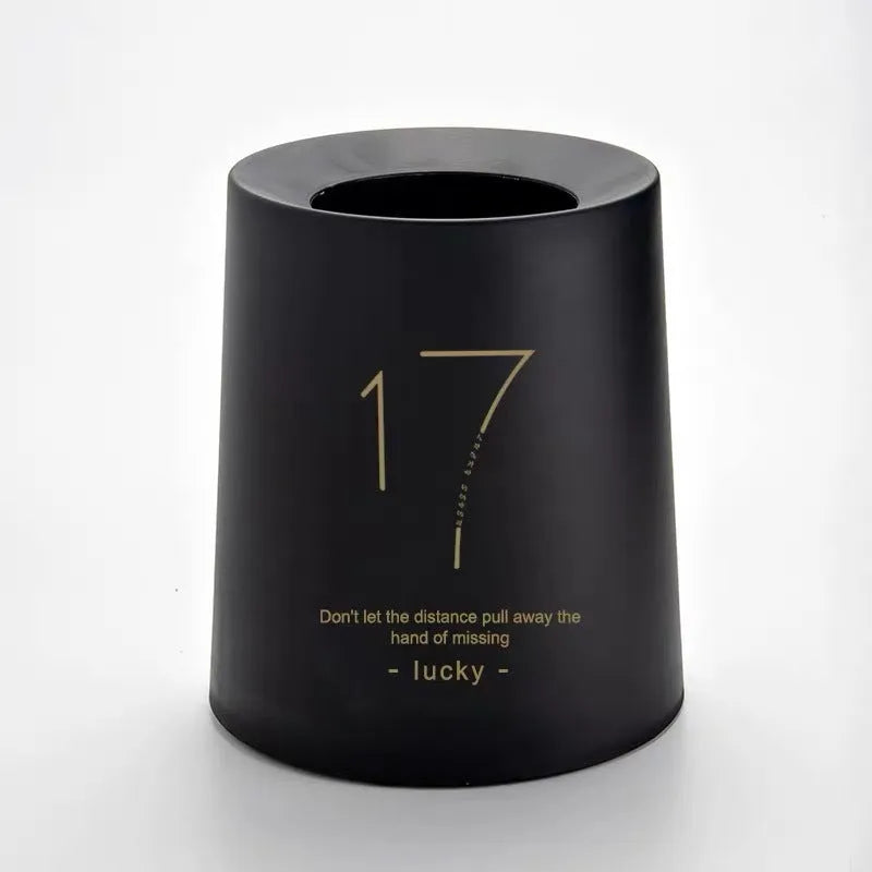 Creative Nordic plastic trash can with decorative pattern in a home setting