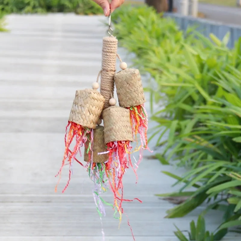 Colourful shredded paper parrot chewing toy with wood and sisal rope construction