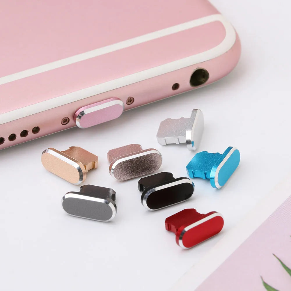 Aluminium alloy iPhone charging port dust plug shown in gold, silver, blue, red, grey, black, rose gold, and rose colours.