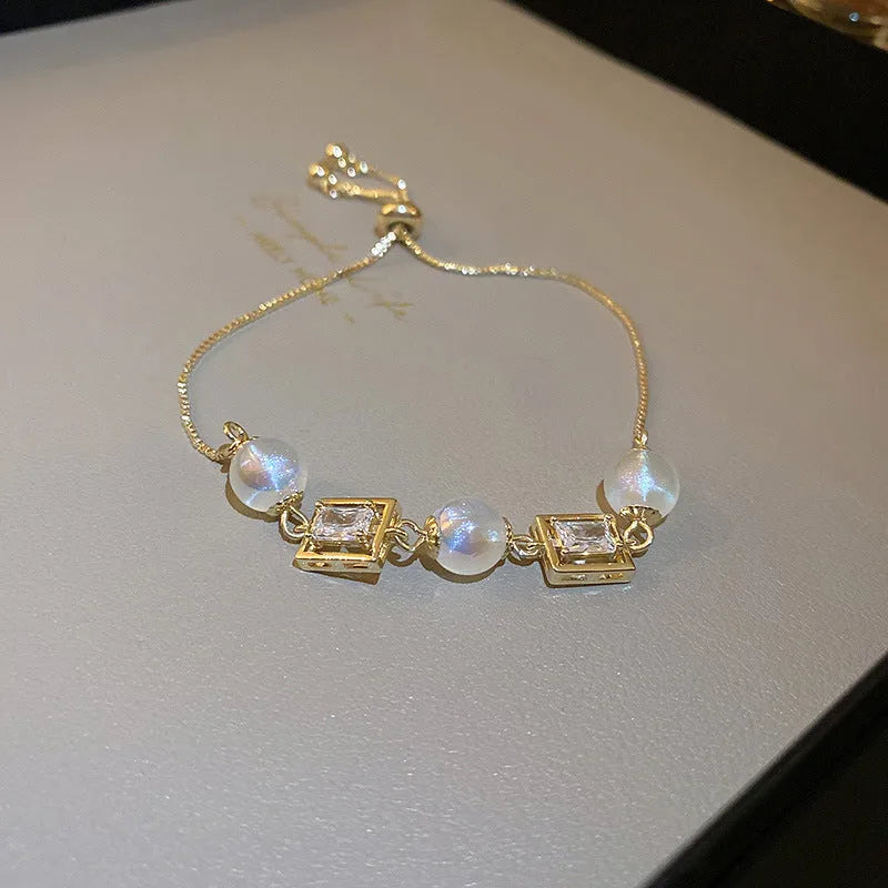 Baroque freshwater pearl zircon bracelet with geometric pearl inlaid design on a woman's wrist