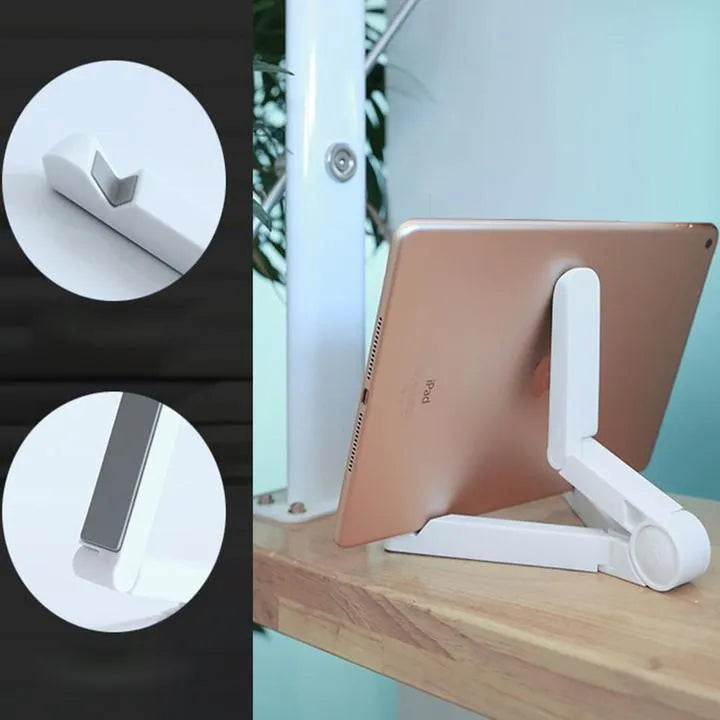 Black foldable tablet holder open on a table, holding a smartphone in landscape mode.