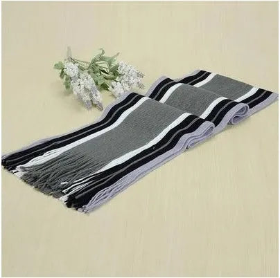 Fringed cotton scarf in solid colour with stripe pattern, 180cm length, 23cm width, laid flat on neutral background