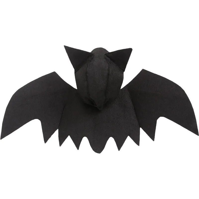 Black felt bat wing costume for cats and dogs with Velcro strap, size L shown on a pet