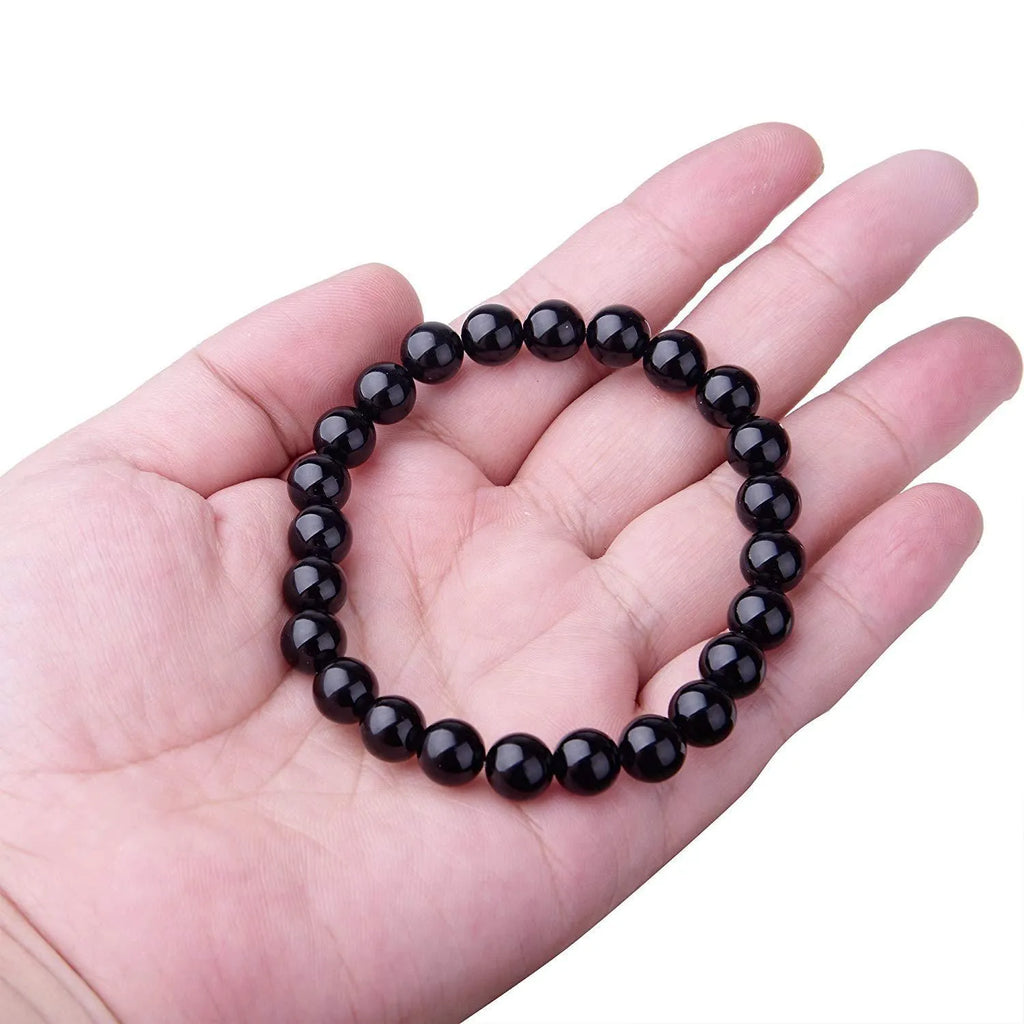 Geometric black agate bracelet with 8mm beads on elastic cord for women.