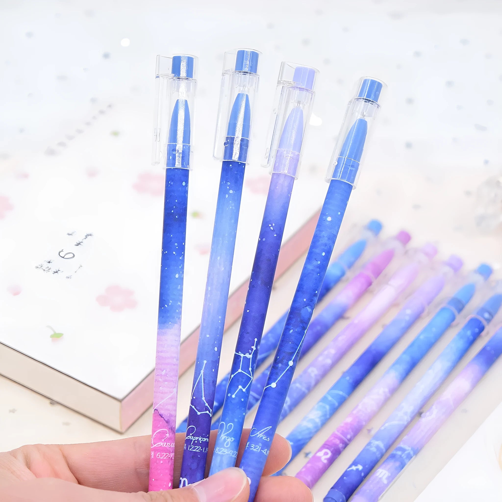 Box of 12 quick-drying gel pens with constellation designs and plastic bodies