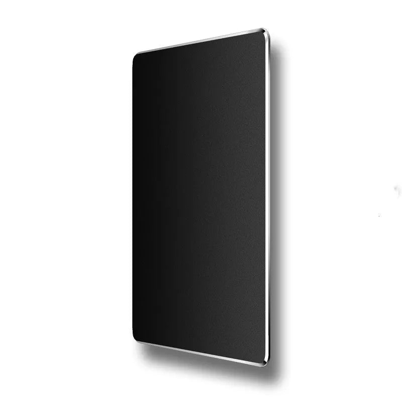 Double-sided aluminium non-slip mouse pad in black with smooth and textured surfaces on a desk