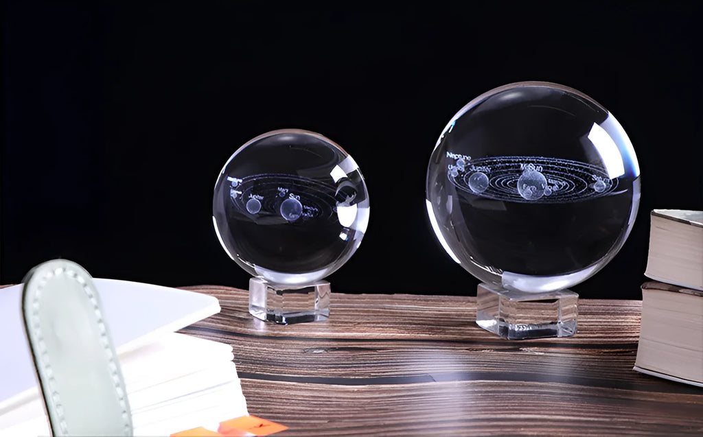 Solar system 3D engraving inside clear K9 crystal ball on a wooden stand