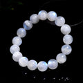Natural blue moonlight round bead moonstone bracelet with geometric shape on a wrist.