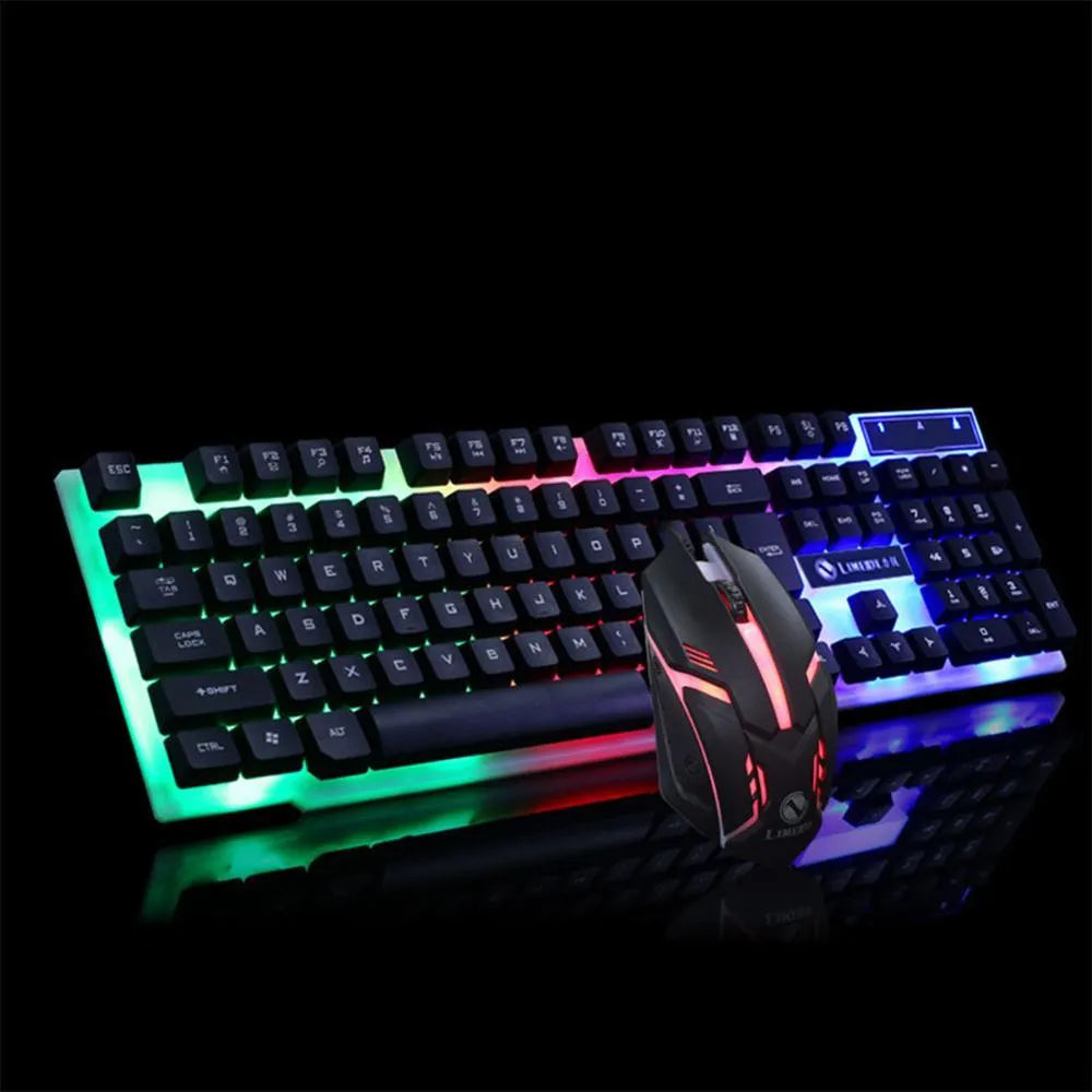 GTX300 black and white wired gaming keyboard and mouse set with colourful backlit keys on desk.