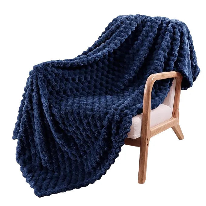 Children's polyester plaid blanket in camel colour with solid pattern showing texture