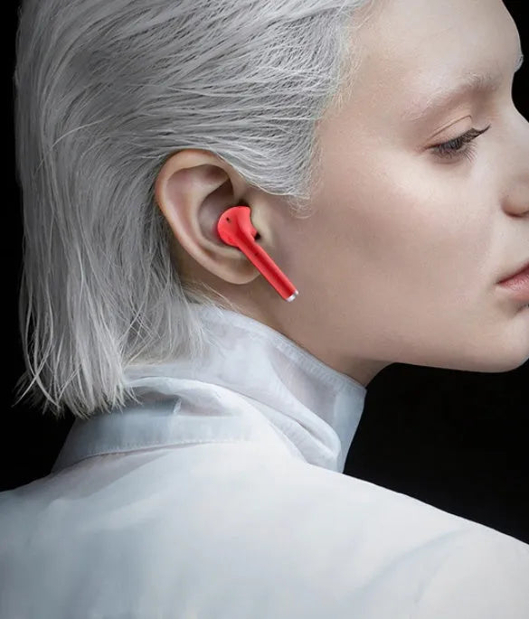Fashion lipstick-shaped wireless Bluetooth earphones in black, pink, purple, and white with charging case.