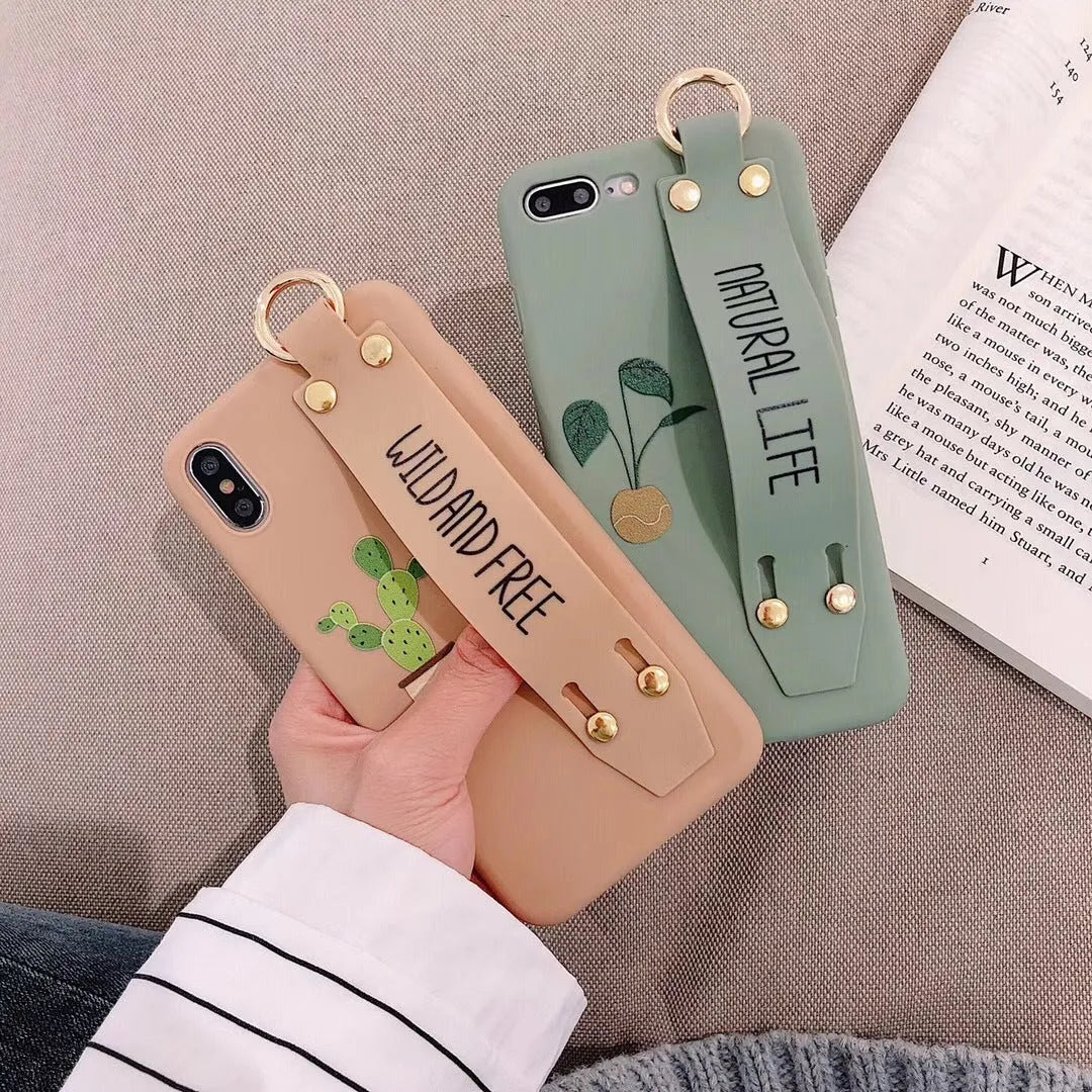 Green graffiti-style phone case with a wristband holder for an iPhone.