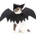 Black felt bat wing costume for cats and dogs with Velcro strap, size L shown on a pet