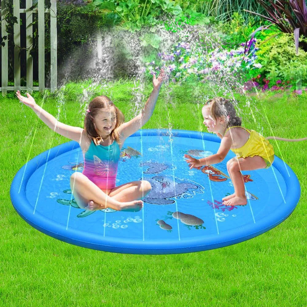 Blue PVC children's water spray pool mat with marine animal designs laid out on grass