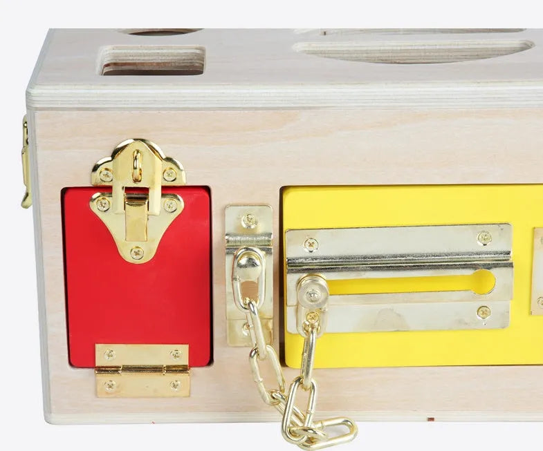 Wooden educational shape sorting lock box toy with coloured blocks for preschool children.