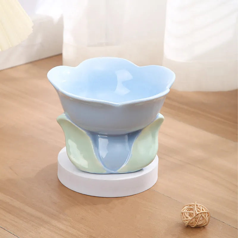 Blue ceramic raised pet bowl with floral pattern and non-slip base for cats or small dogs