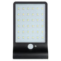 Black and white outdoor solar garden light with solar panel and IP65 waterproof rating.