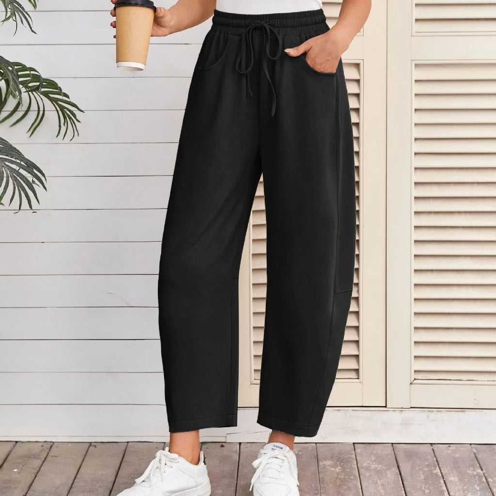 Loose cropped cotton sweatpants with drawstring waist and side pockets in street fashion style