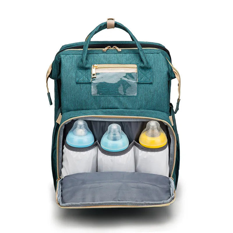 Folding baby bag bed backpack with portable mattress, USB charging option, front pocket, and multiple colour choices