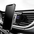 Black car phone holder mounted on car air vent with adjustable clamp mechanism