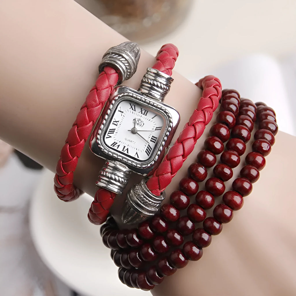 Snake bracelet quartz watch with leather strap and alloy buckle on a black background