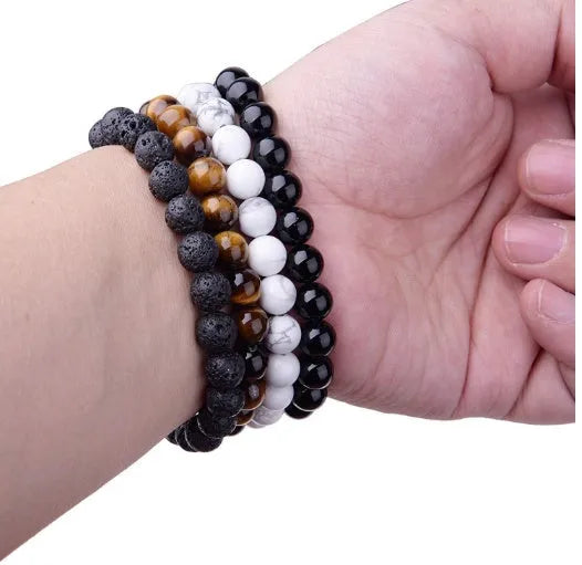Geometric black agate bracelet with 8mm beads on elastic cord for women.