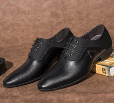 Men's black Oxford shoe with rubber sole and low upper height on a white background