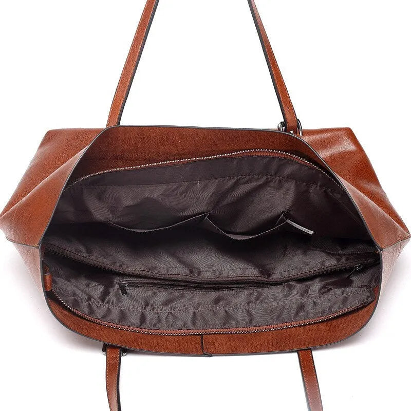 Women's wax cowhide leather crossbody handbag in five colour options showing two compartments and phone pocket.