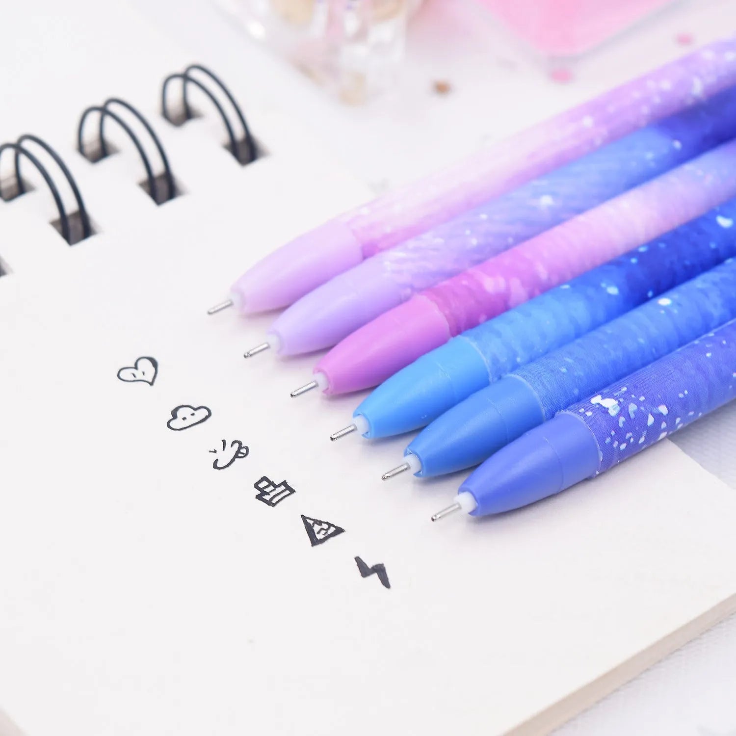 Box of 12 quick-drying gel pens with constellation designs and plastic bodies