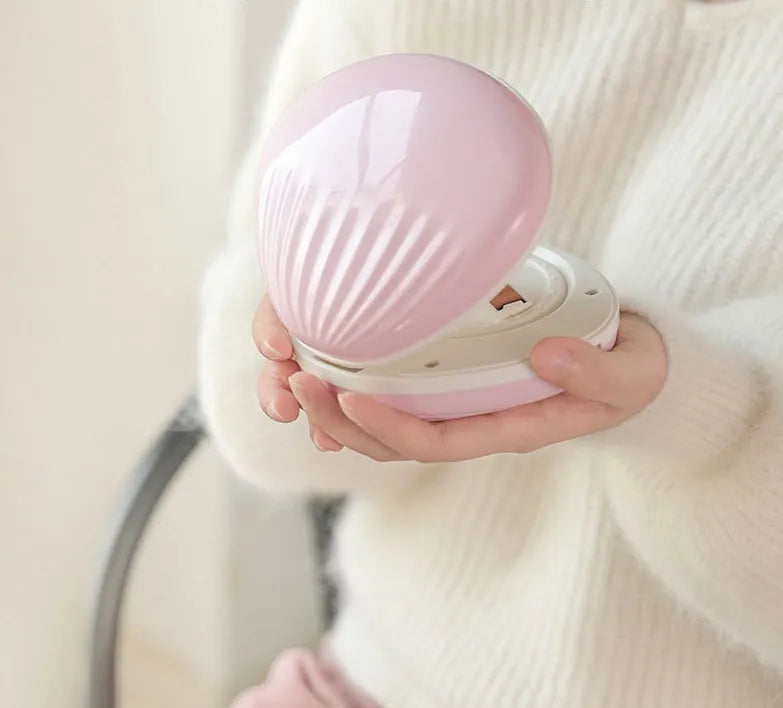Shell rainbow projection light in blue or pink, ABS plastic, 130 x 118 x 54mm, USB 5V 1A, 1200mAh battery.