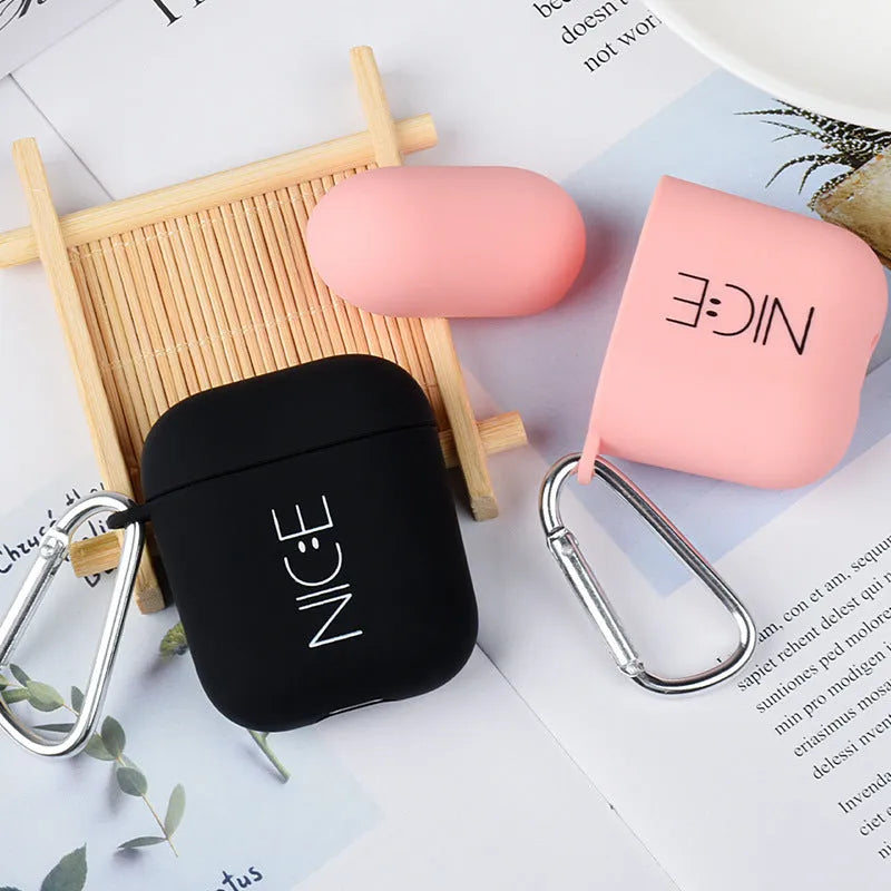 Black and pink hard PC protective cases for AirPods with decorative flower, love, and smiley face designs