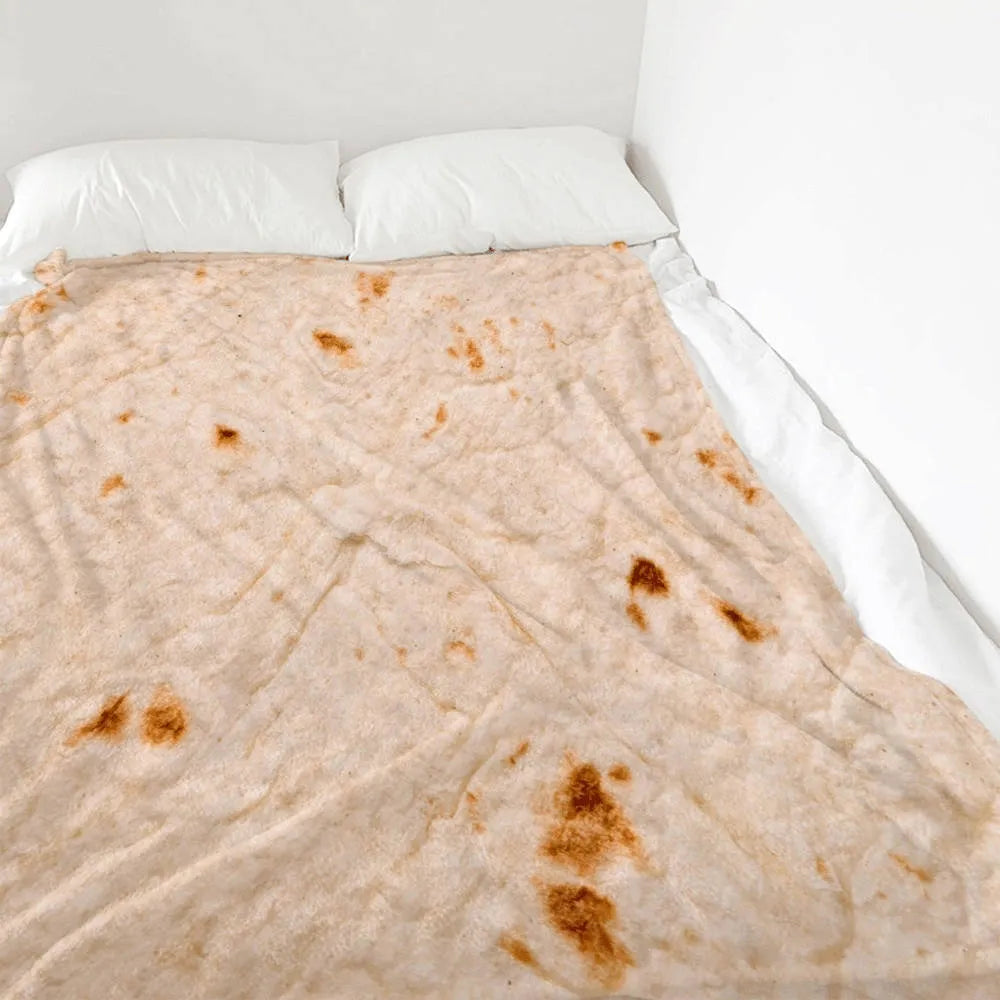 Round coral fleece burrito blanket with printed design on soft flannel fabric.