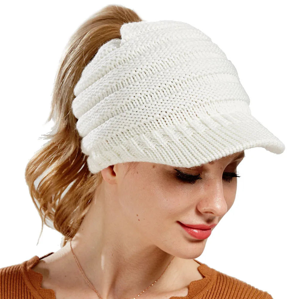 Women's knitted beanie with ponytail hole in acrylic yarn for winter wear