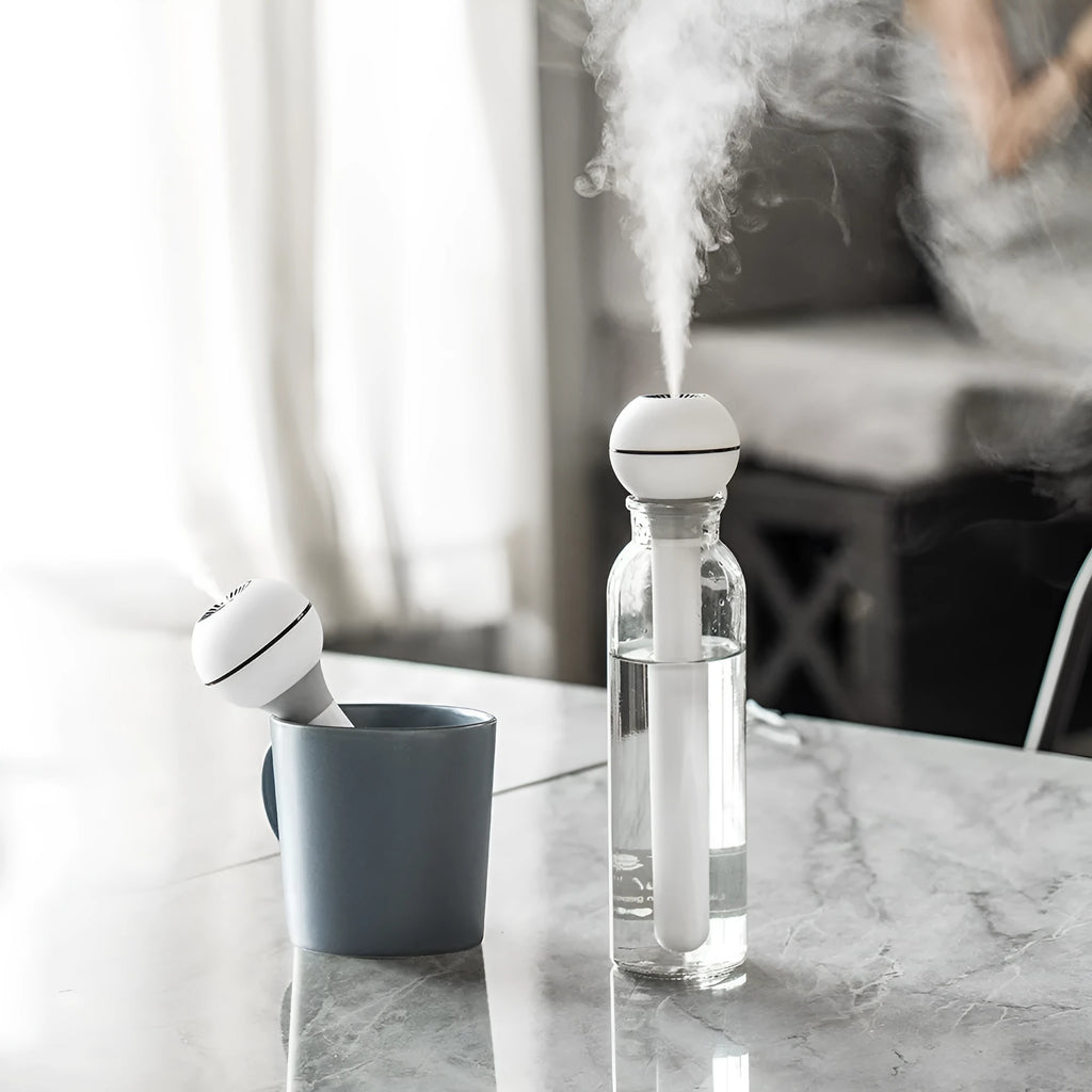 Columnar USB-powered humidifier with transparent 1-litre water tank in pink colour option