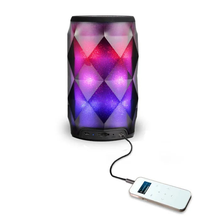 Black crystal diamond cut Coca-Cola can Bluetooth speaker lantern with colourful LED lights illuminated.