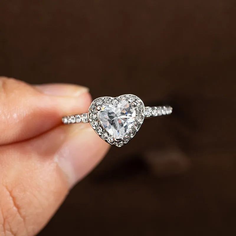 Heart-shaped women's wedding ring with crystal setting in rose gold or silvery electroplated finish