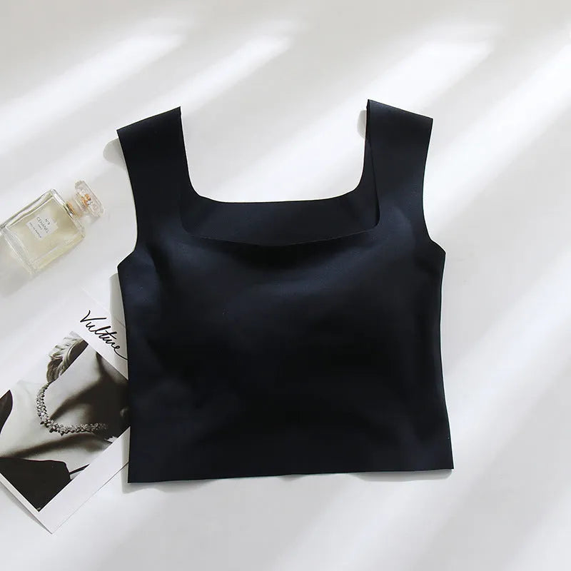 Women's non-marking seamless nylon sling vest with chest pad in light blue, shown from the back.