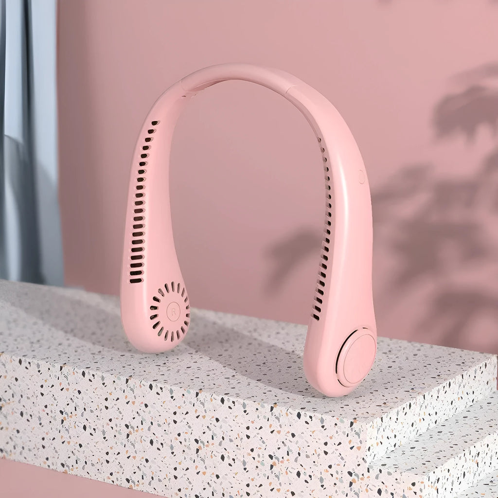 Pink bladeless neck fan hanging around neck with USB charging cable