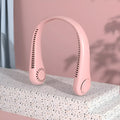 Pink bladeless neck fan hanging around neck with USB charging cable